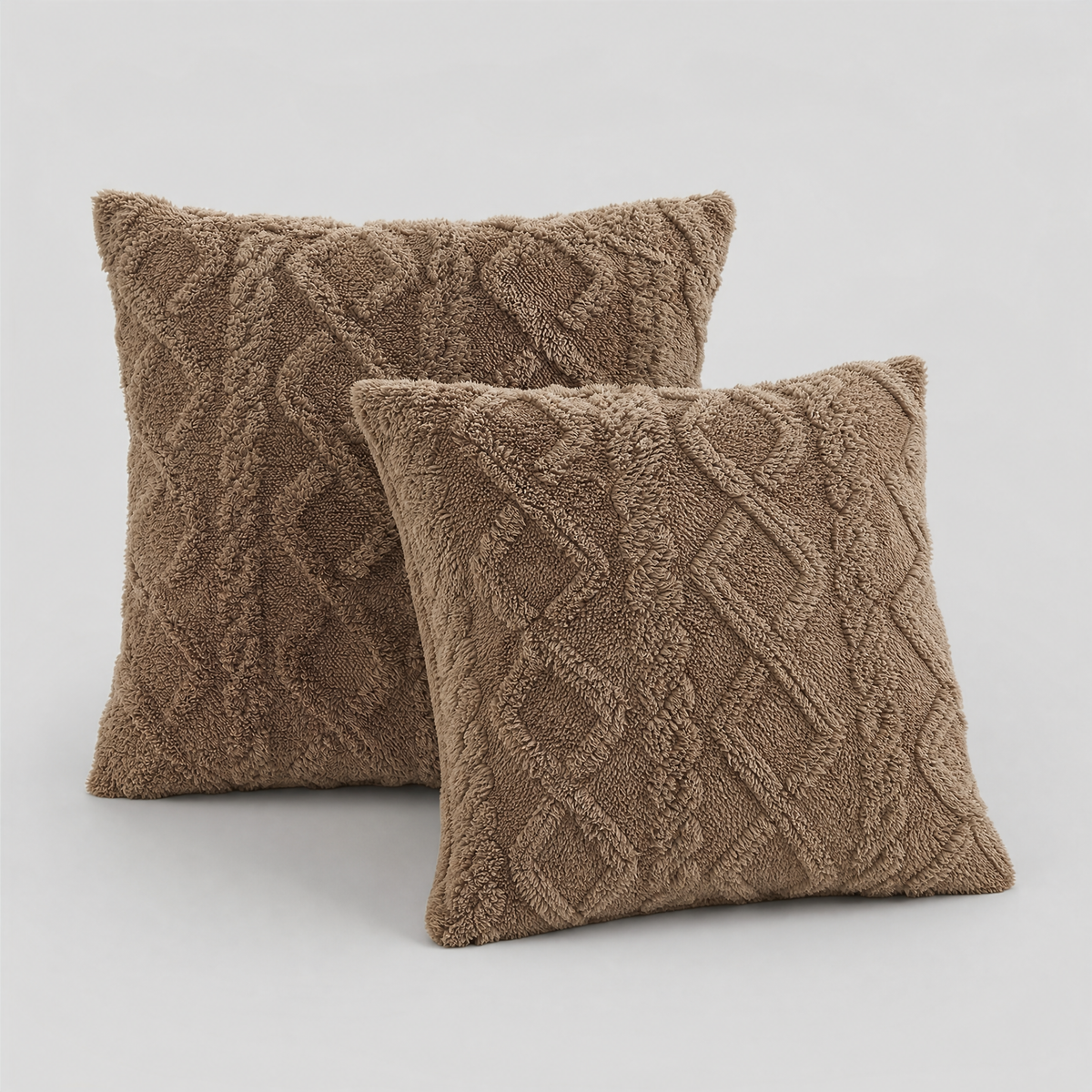 Coffee cable knit plush cushion covers, set of 2, on a light grey background