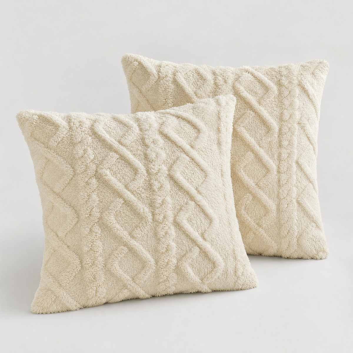 Beige cable knit plush cushion covers, set of 2, on a light grey background