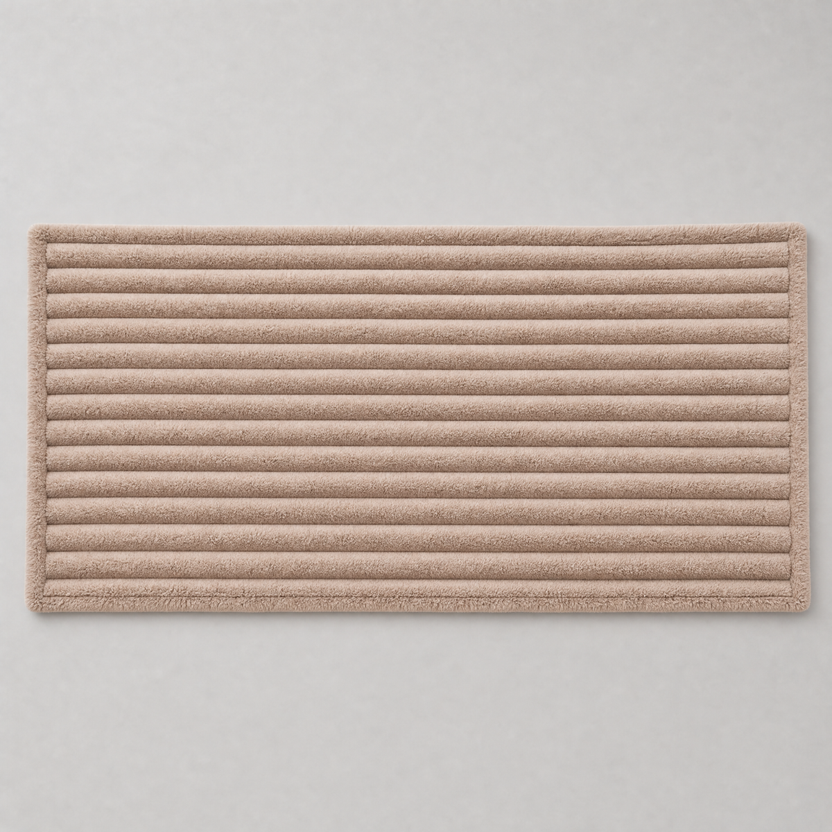 Latte chunky ribbed couch cover laid flat, seen from above