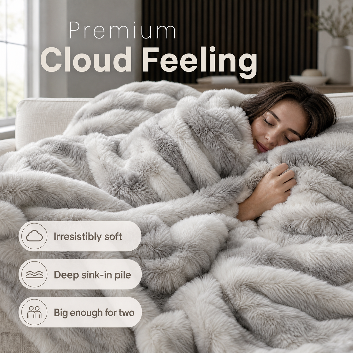 Marbled faux fur blanket on a couch with a woman resting under it