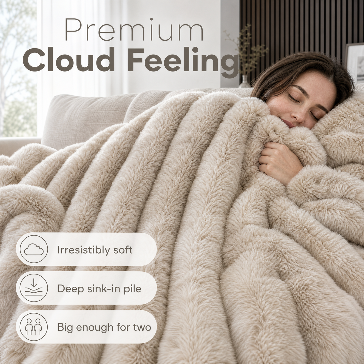 Sand cream ribbed plush blanket on a couch with a woman resting under it