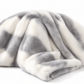 Marbled faux fur blanket on a white background