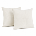 Two cream corduroy cushion covers on a white background