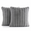 Two grey faux fur cushion covers on a white background