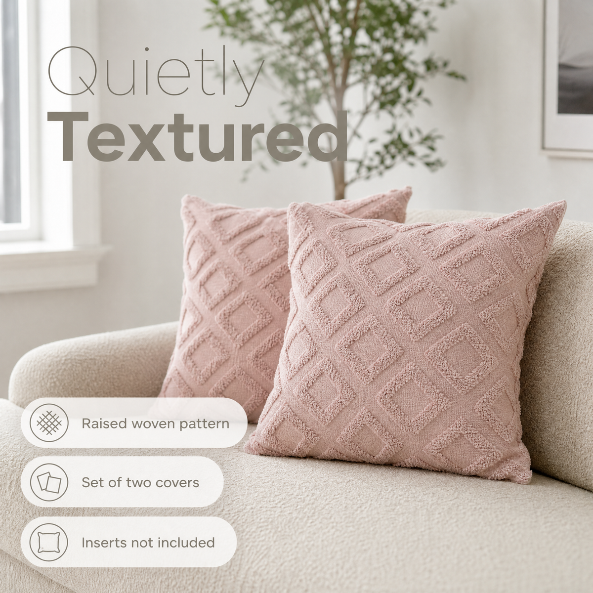 Blush pink tufted cushions on a boucle sofa
