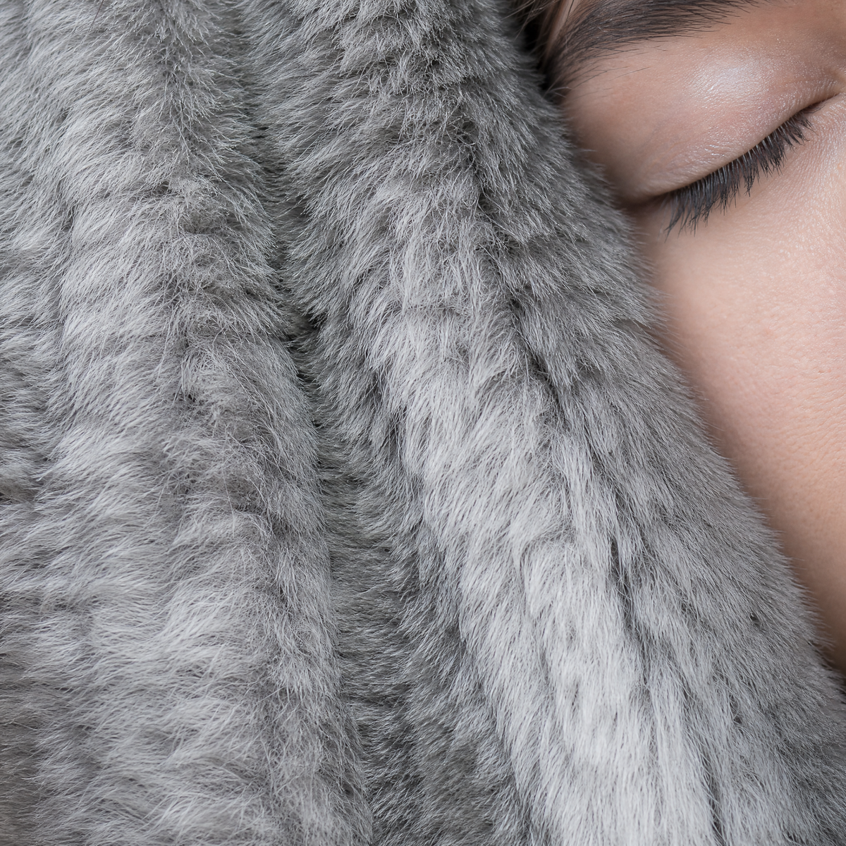 Close up of the grey faux fur pile