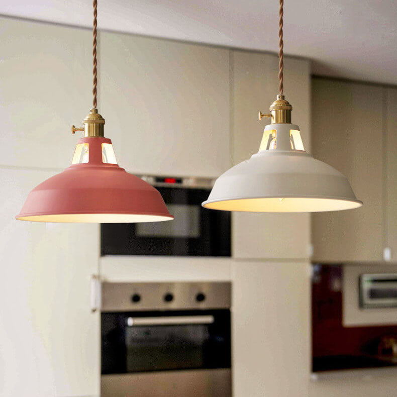 Pink and white barn pendant lights in a kitchen