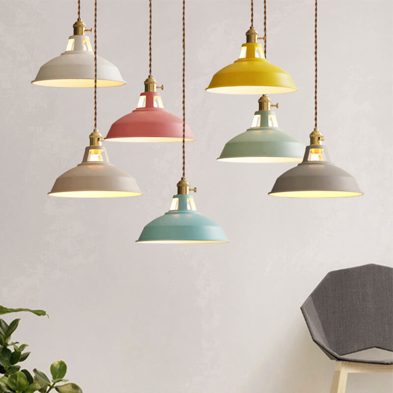 Barn pendant lights in several colors hanging together