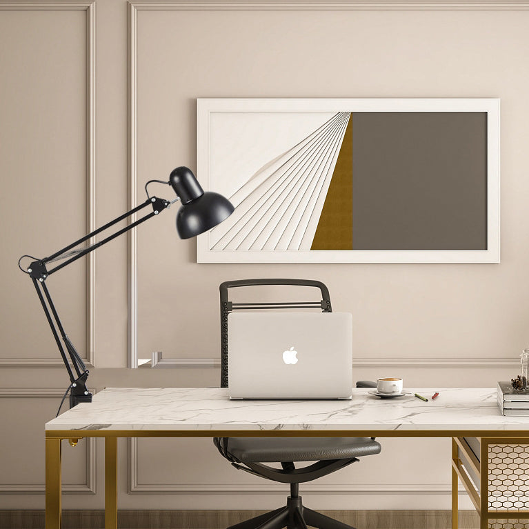 Clip on reading lamp lighting a desk