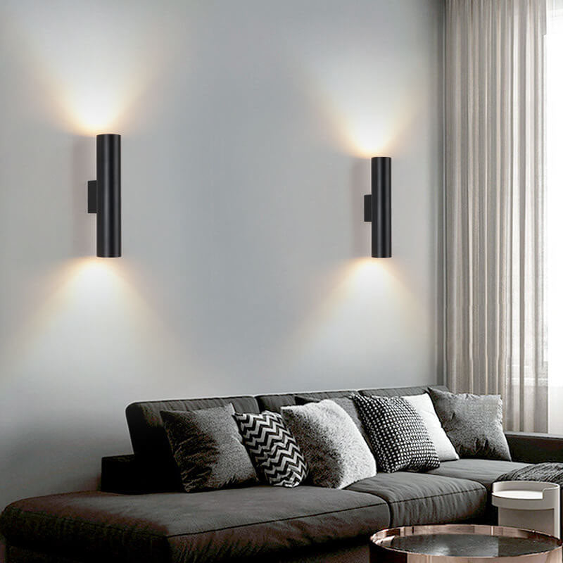 Black cylinder wall sconces with up and down light