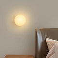 Glass Orb Wall Sconce switched on