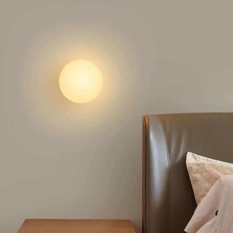 Glass Orb Wall Sconce switched on