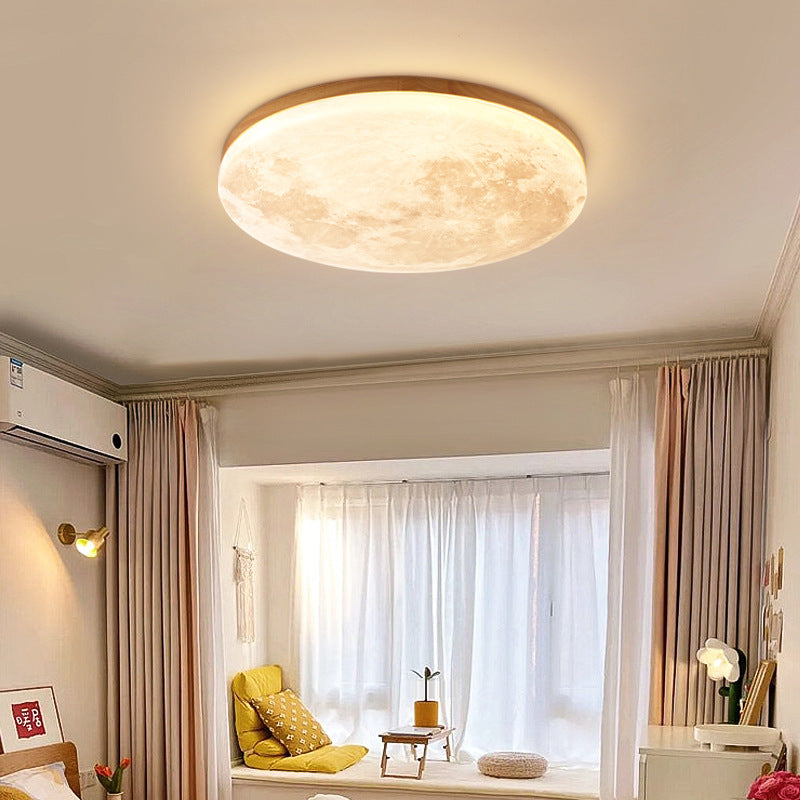 Moon flush mount light switched on in a living room