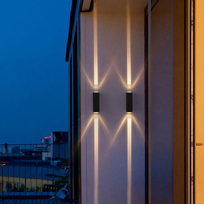 Black outdoor up and down wall lights on a house front