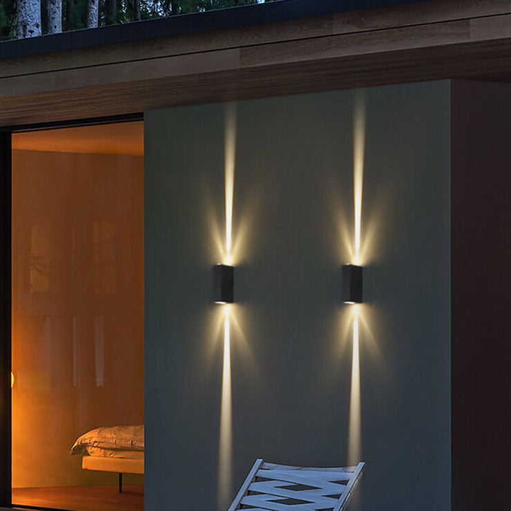 Outdoor wall light beside a front door at night
