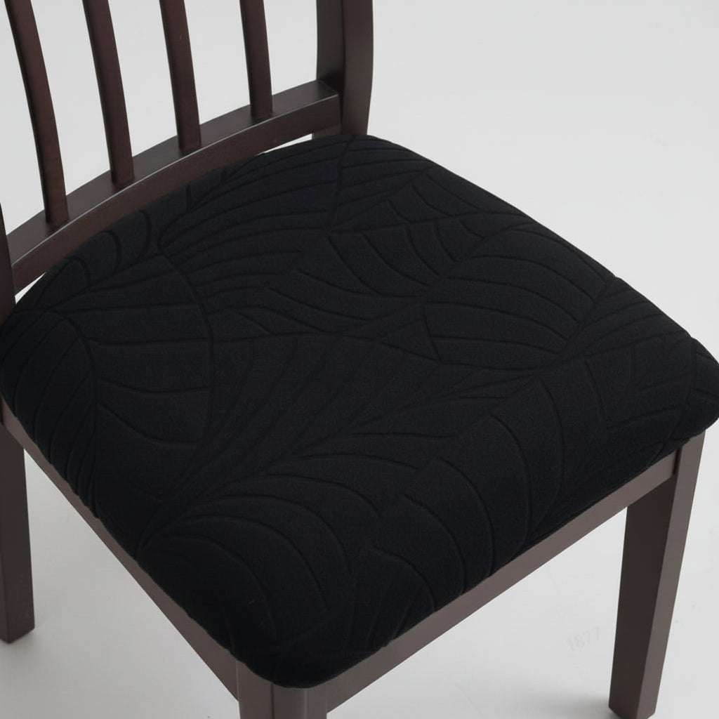 Black leaf pattern seat cover on a dining chair