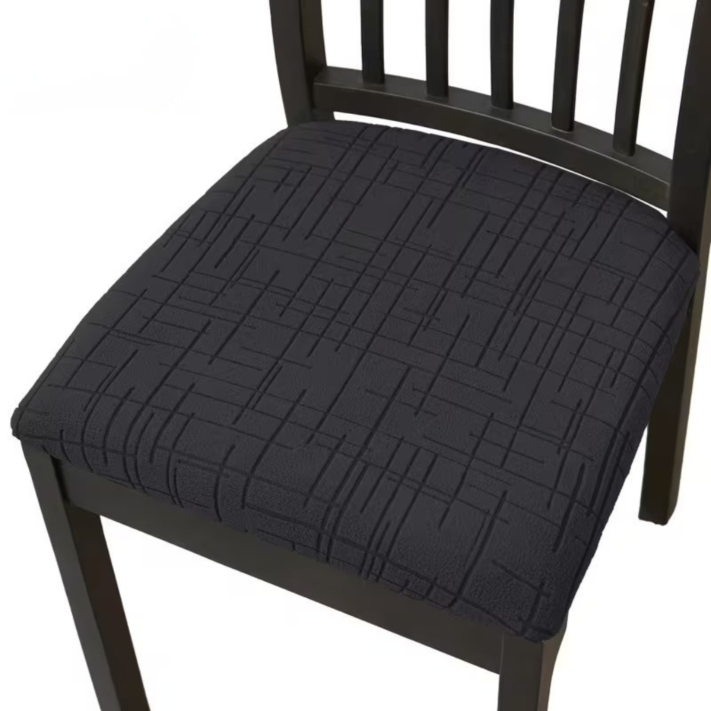 Black stretch seat cover on a dining chair