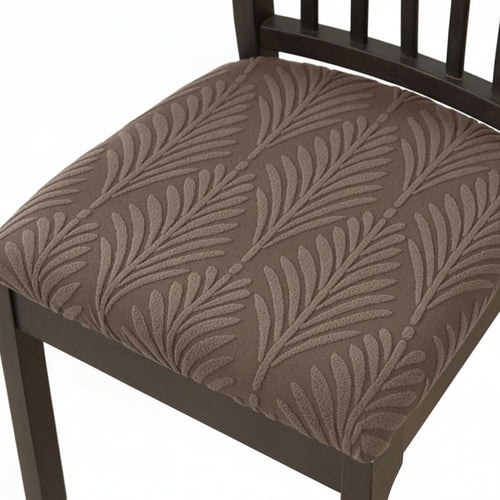 Brown leaf pattern seat cover on a dining chair