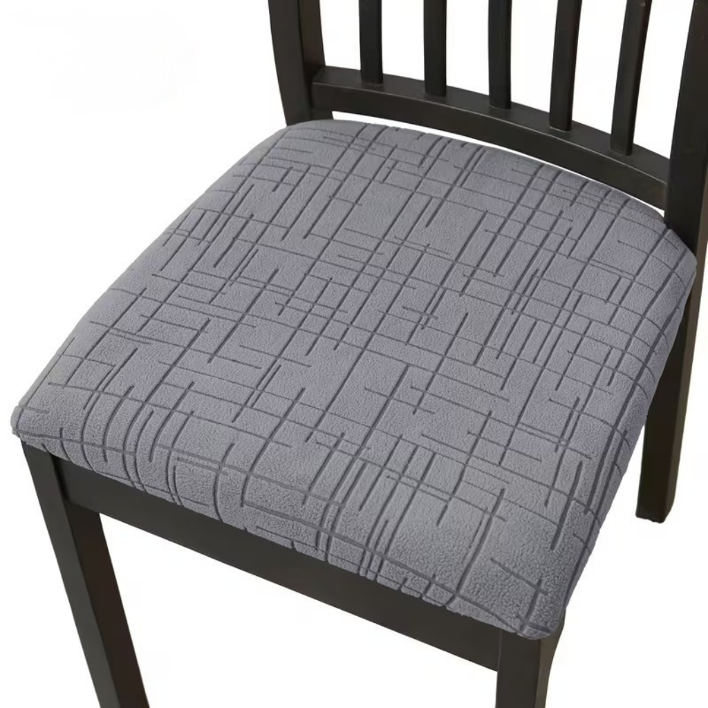 Dark gray stretch seat cover on a dining chair