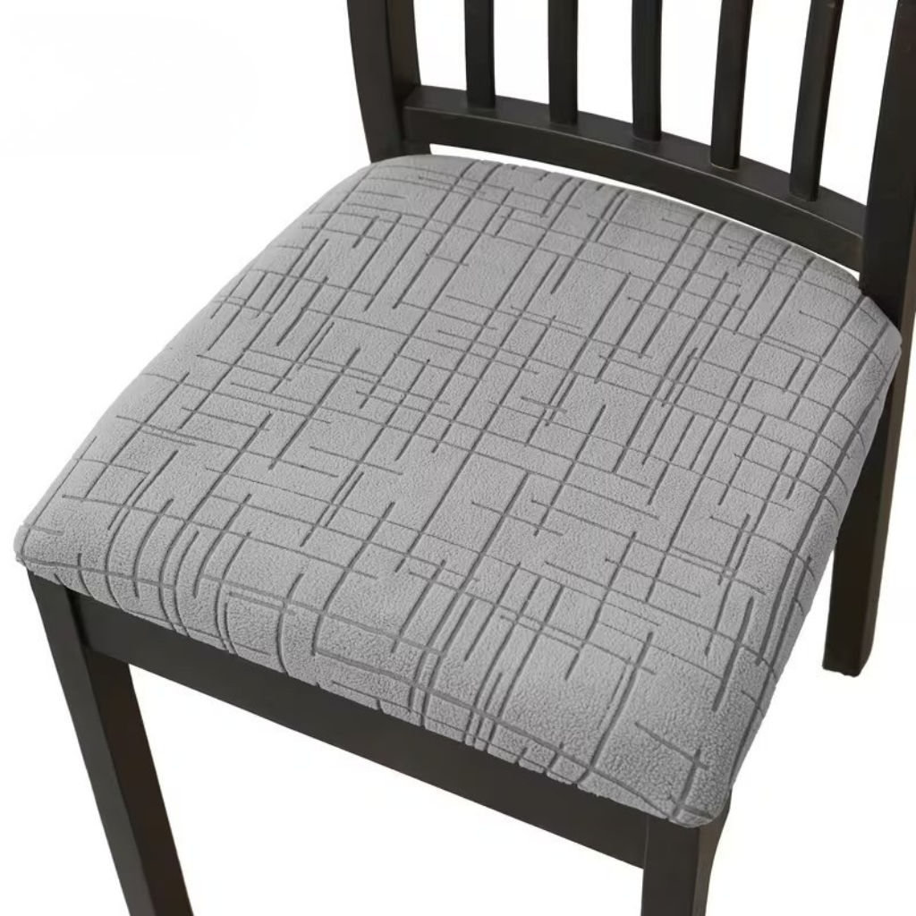 Light gray stretch seat cover on a dining chair