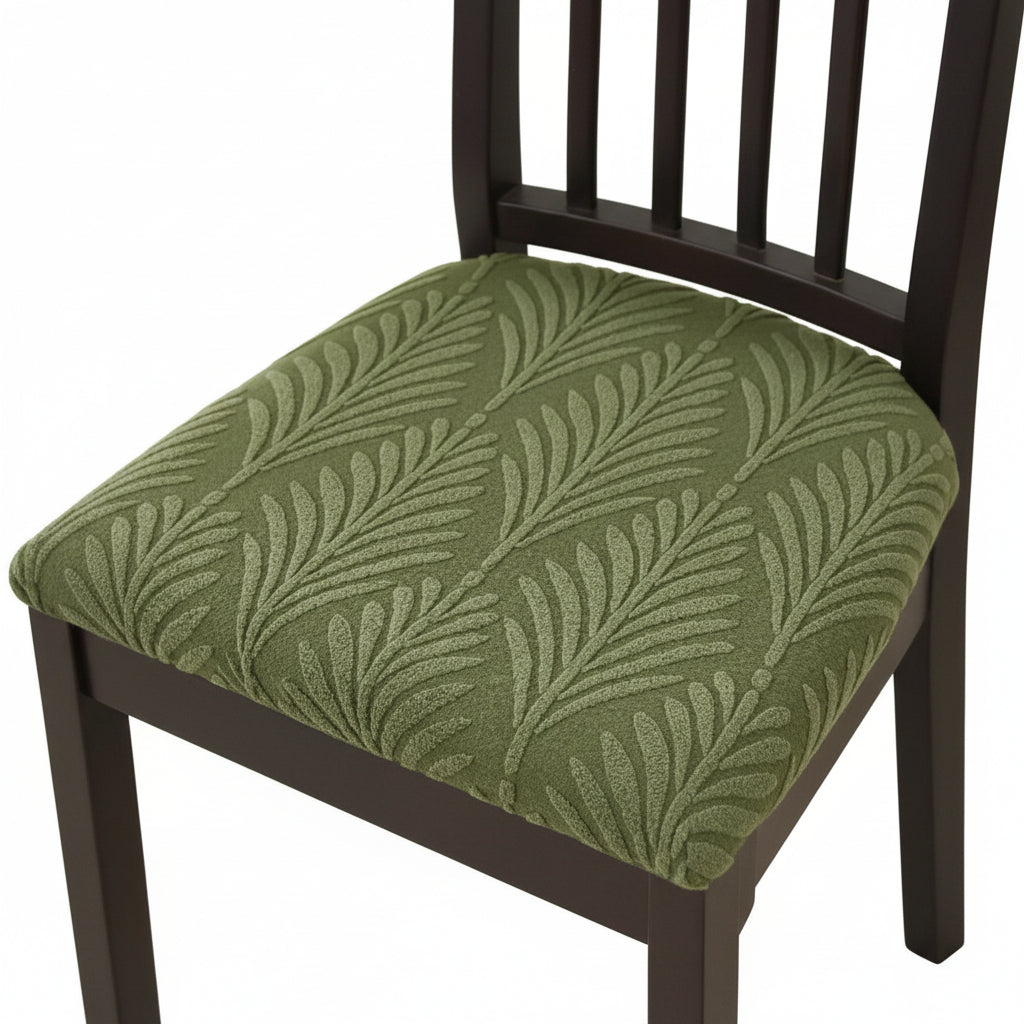 Sage green stretch seat cover on a dining chair