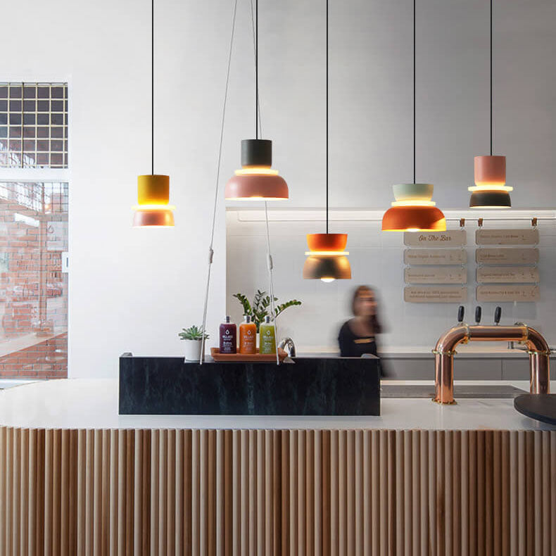 Pastel metal pendant light hanging in a kitchen